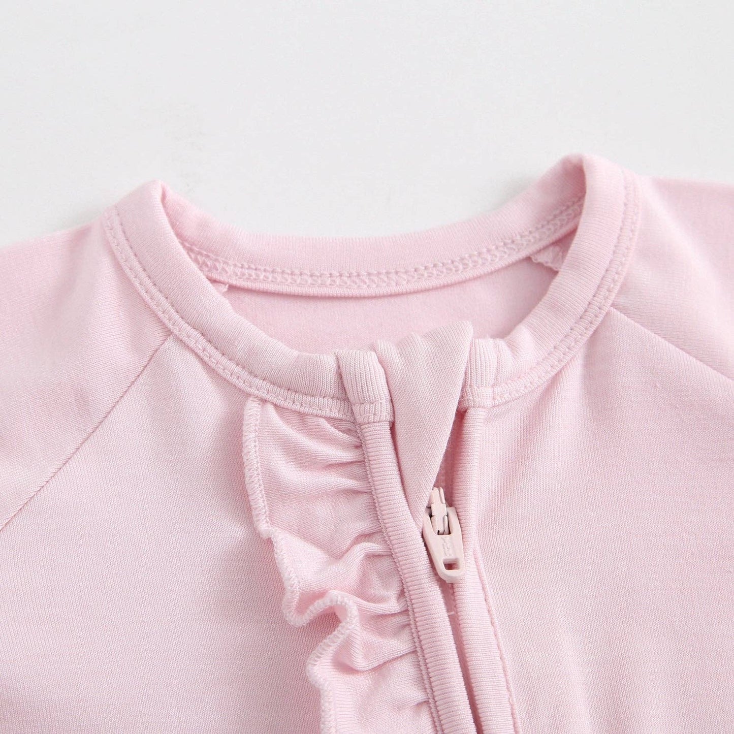 Dawn Ruffled Zippered Baby Romper | Pink